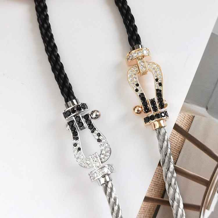 [Sparkle]GROSSES HUFEISEN-ARMBAND MIT SCHWARZEN UND WEISSEN DIAMANTEN - WEISSGOLD
